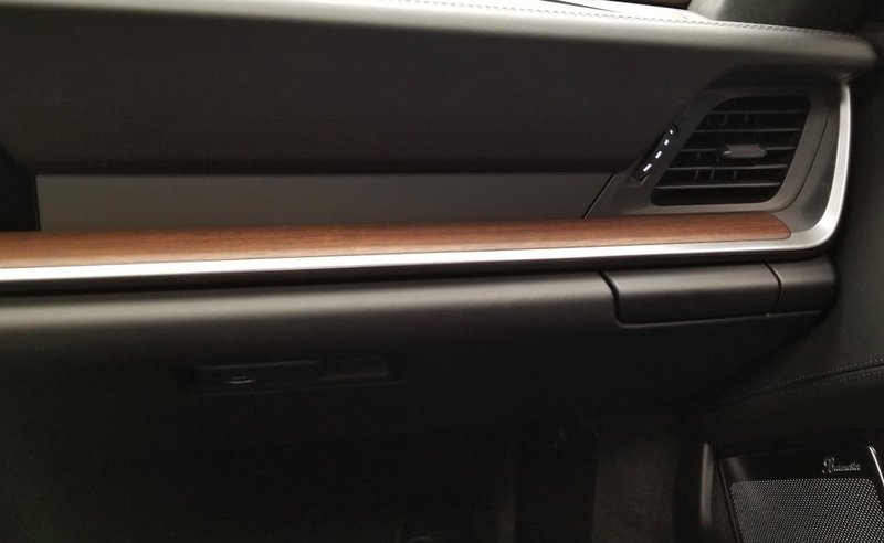 Illustration for article titled The Needlessly Complicated Cupholders in the Porsche 911 Are Awesome